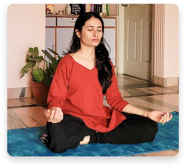 A practitioner seated in Padmasana with eyes closed during a daily Hatha Yoga practice